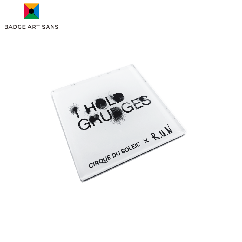  Close-up of black stencil typography and textured finish on acrylic custom fridge magnet